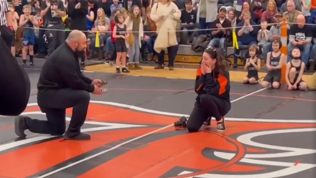 Wrestling referee emerges victorious in the match of love by stunning photographer GF with a proposal