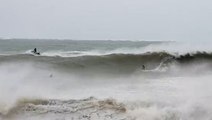 Watch as surfers ride huge waves during Cyclone Gabrielle winds