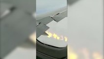 Delta passenger films flames coming out of wing mid-air flight