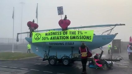 Extinction Rebellion target private jets at Luton airport in Valentine’s Day protest