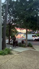 Man Carries Around Street Sign