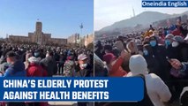 China: Elderly protest health insurance cuts in Wuhan | Oneindia News