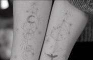 Olivia Wilde has shown off the constellation sign tattoos she has had inked on both forearms