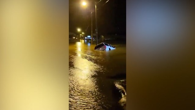Severe Kentucky floods leave car stuck on submerged road