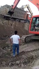 Excavator saving heavy truck