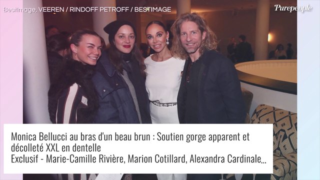 Monica Bellucci au bras d'un beau brun aux yeux bleus : soutien gorge apparent et décolleté XXL en dentelle