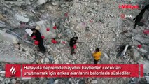 Depremde hayatını kaybeden çocuklar için enkazları balonla süslediler