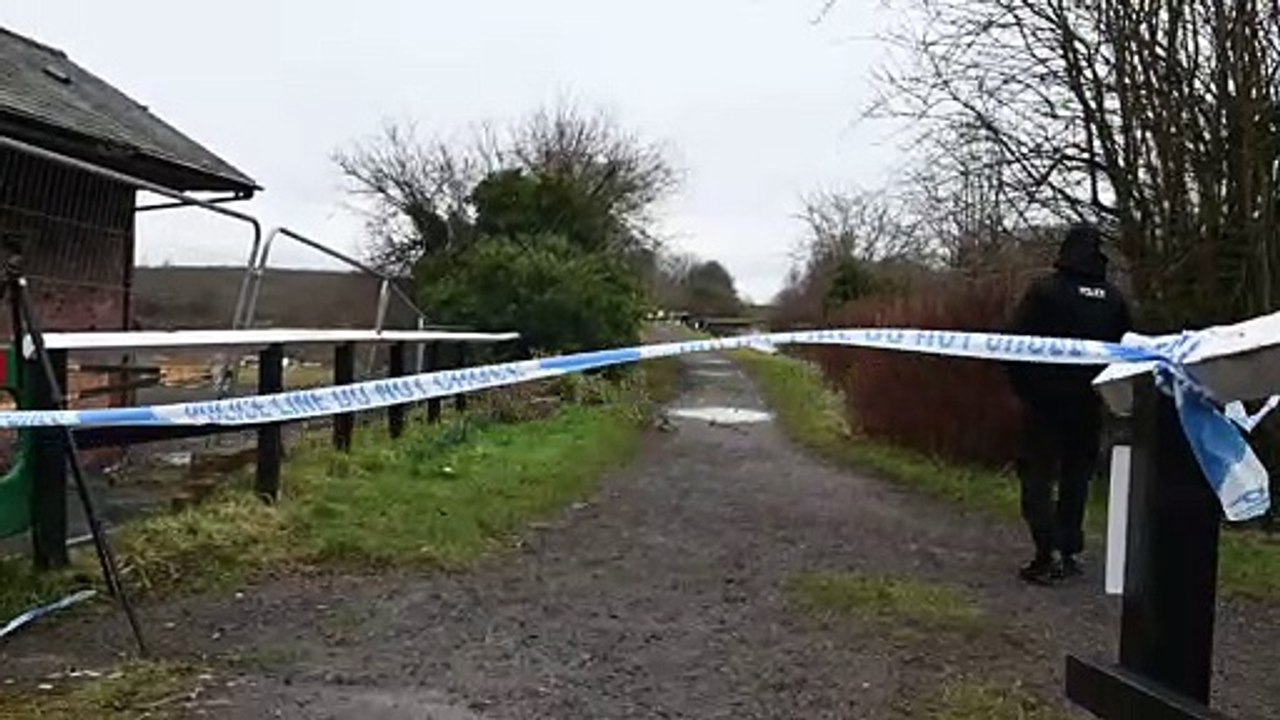 Police at the scene of suspected arson attack