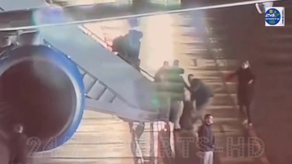 This time, it wasn't Joe! Female White House staffer takes a tumble down government jet steps ... but backpack cushions her fall