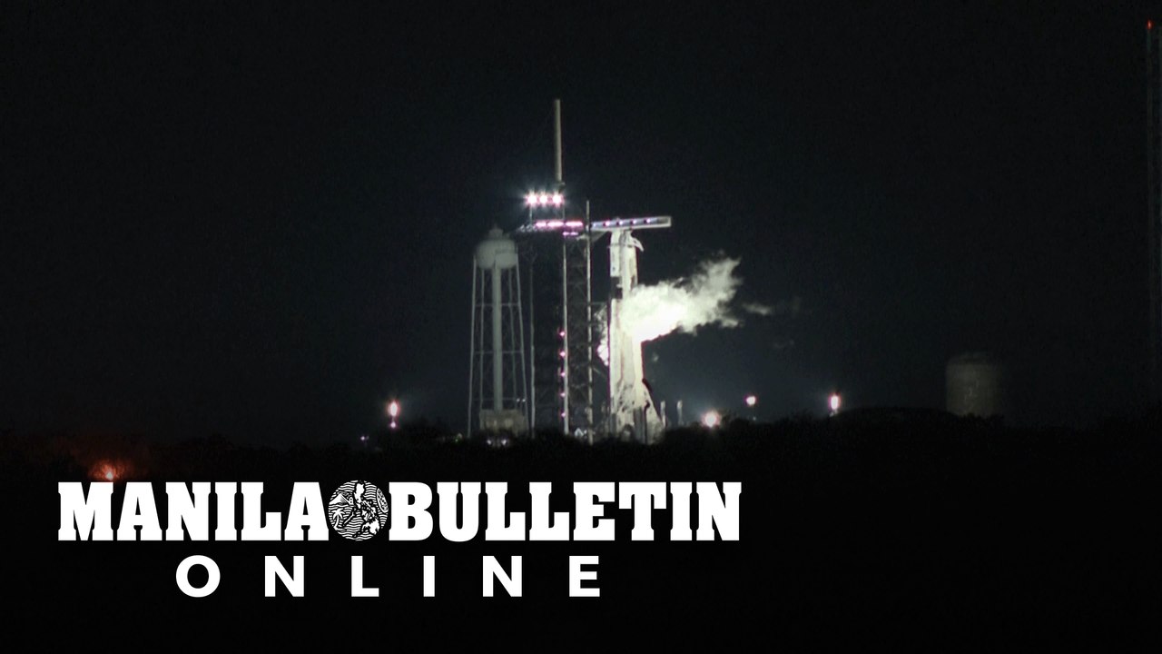 SpaceX crew members wave goodbye to family and...