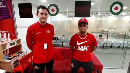 SAFC star Jewison Bennette enjoys a kick-about and Xbox challenge against children at the Beacon of Light