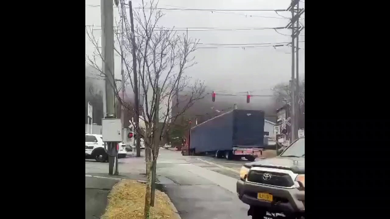Warning:A freight train has slammed into a tractor-trailer