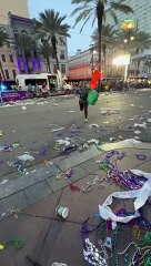 Woman Slips on Mardi Gras Beads