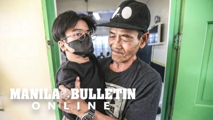 Grandfather carry his PWD grandson to his precinct for him to cast his vote