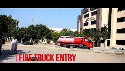 Fire Truck forming a Rainbow while watering