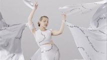 Ukrainian designer and British artists create ‘love letter’ dress to mark anniversary of Russian invasion