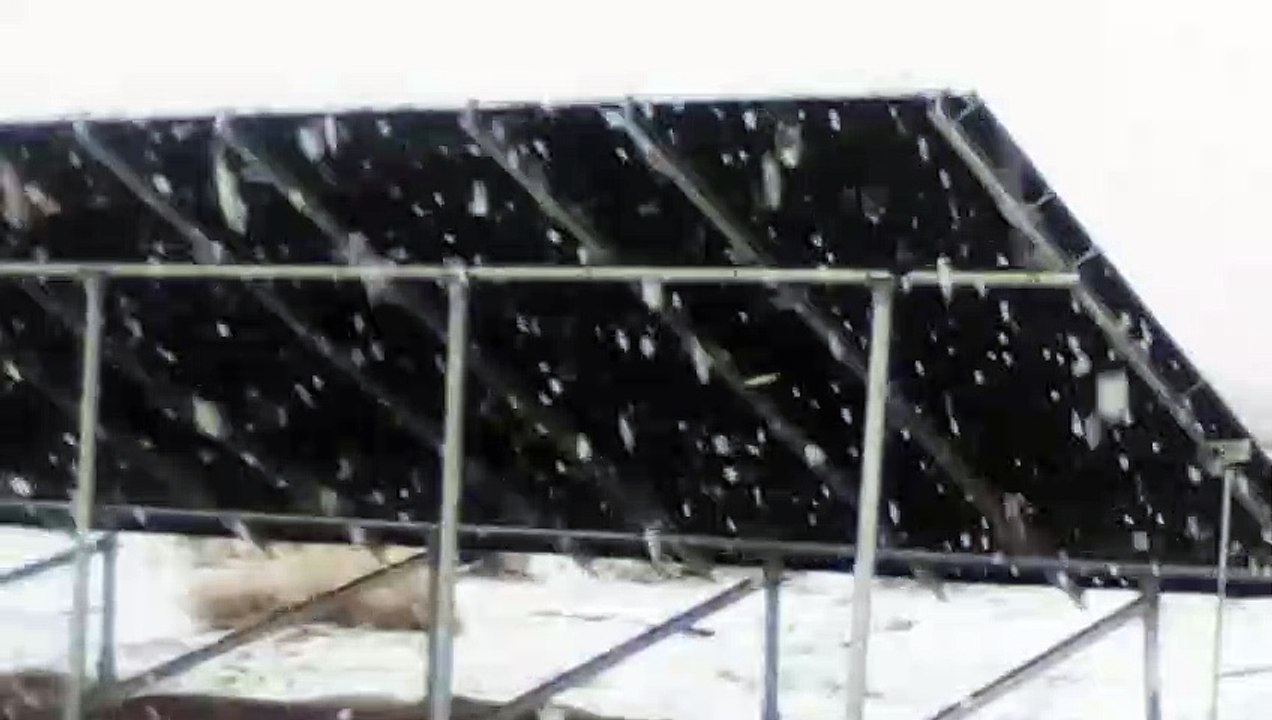 Snowing in front of soler panel