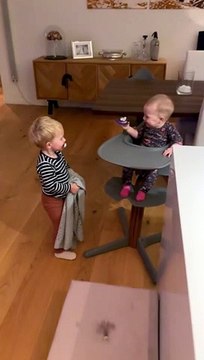 Baby Laughs at Older Brother Playing Peek-a-Boo