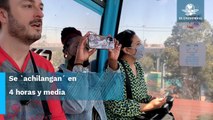 Extranjeros turistean en el Cablebús en Iztapalapa