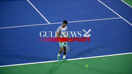 Novak Djokovic practices on Center Court at the Dubai Tennis Stadium