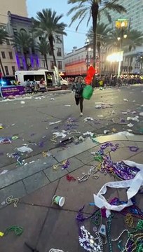 Woman Slips on Mardi Gras Beads