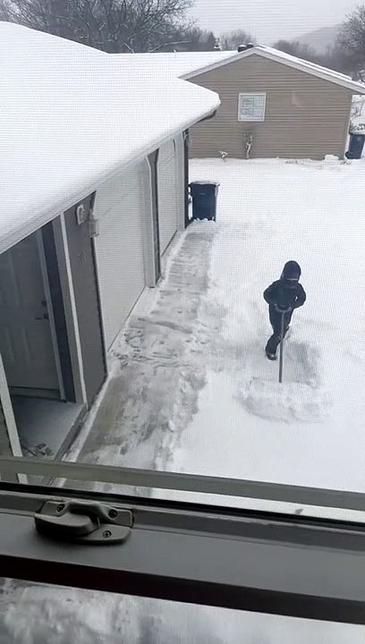 Girl Tries Her Best to Shovel Snow