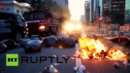RAW- Police brutally clash with protesters at transport hike demo in Brazil