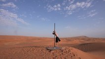 Pole Dancer Shows Amazing Balance While Performing in Desert
