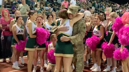 Military Dad Surprises Cheerleader Daughter By Photobombing Group Photo