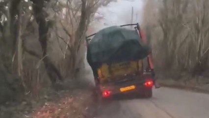 Overloaded Skip truck nearly tips over *footage to keep you on the edge*