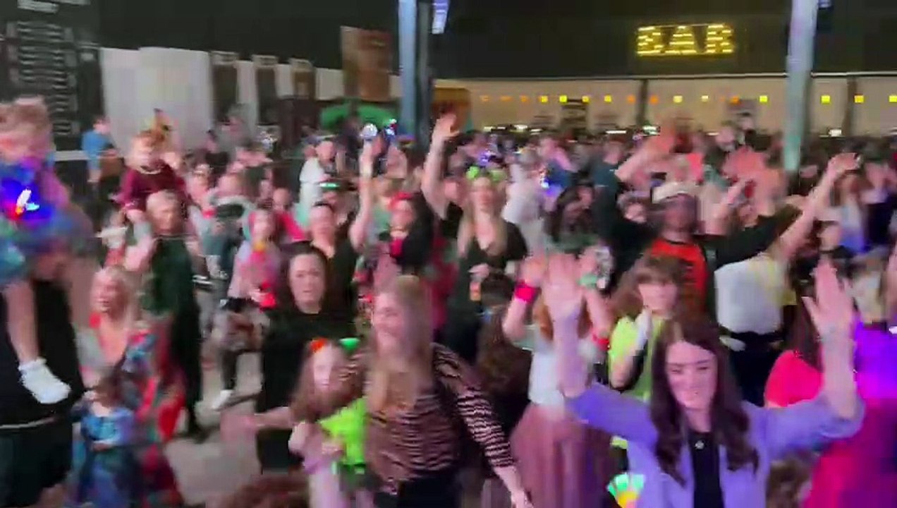 Parents and kids having an awesome time at a Mini Ravers show
