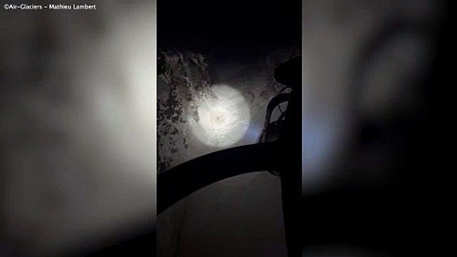 Incredible moment missing hiker buried under snow managed to wave down rescue chopper with only his head and one arm free