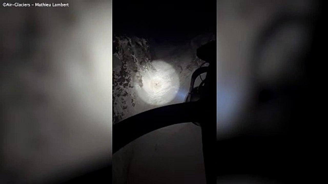 Incredible moment missing hiker buried under snow managed to wave down rescue chopper with only his head and one arm free