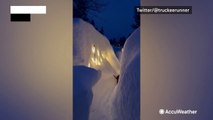Walls of snow towers a backyard path in California