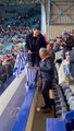 Sheffield Wednesday chairman Dejphon Chansiri waves an Owls shirt in celebration at their win over Peterborough United