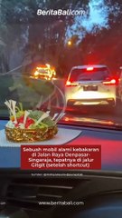 Mobil alami kebakaran di Jalan Raya Denpasar-Singaraja, tepatnya di jalur Gitgit (setelah shortcut), Senin (6/3). Saat ini sudah dalam penanganan petugas.