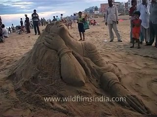 Figure of a woman made in the long sandy beach of Puri, Odhisa