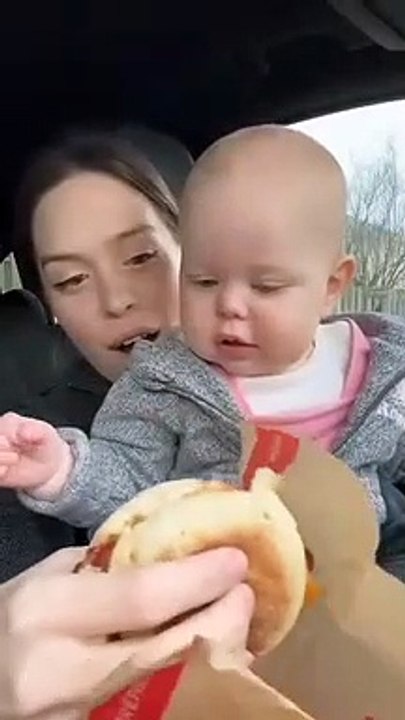 Mother And Cute Daughter Emby Lunch In Car