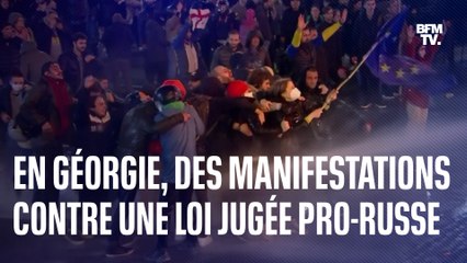 En Géorgie, une manifestante brandit un drapeau européen contre un projet de loi controversé