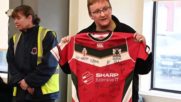 Pupils sing at rugby presentation