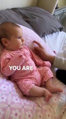 Kind words from big sister makes baby girl smile