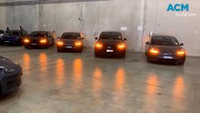 Teslas flashing their hazard lights in the Hume delivery centre