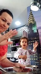 Little Girl Helping Mom Bake Mixed Cake Adds an Extra Ingredient