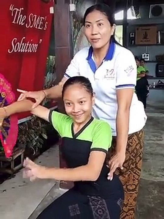 Teacher helping students with choreography