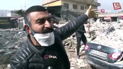 Kahramanmaraş’ta enkazdan çıkardıkları otomobili elleriyle temizlediler