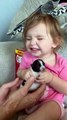 Little Girl Reacts to Holding Tiny Puppy