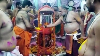 Bholenath and devotees bathed in color
