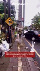 3D artist asal Rusia, membuat efek CGI yang menampilkan Ganesha di trotoar jalanan Ubud, Bali.