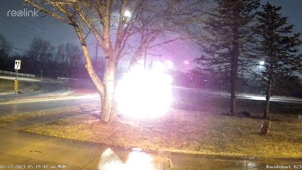 Driver Loses Control Entering Roundabout on Slick Streets