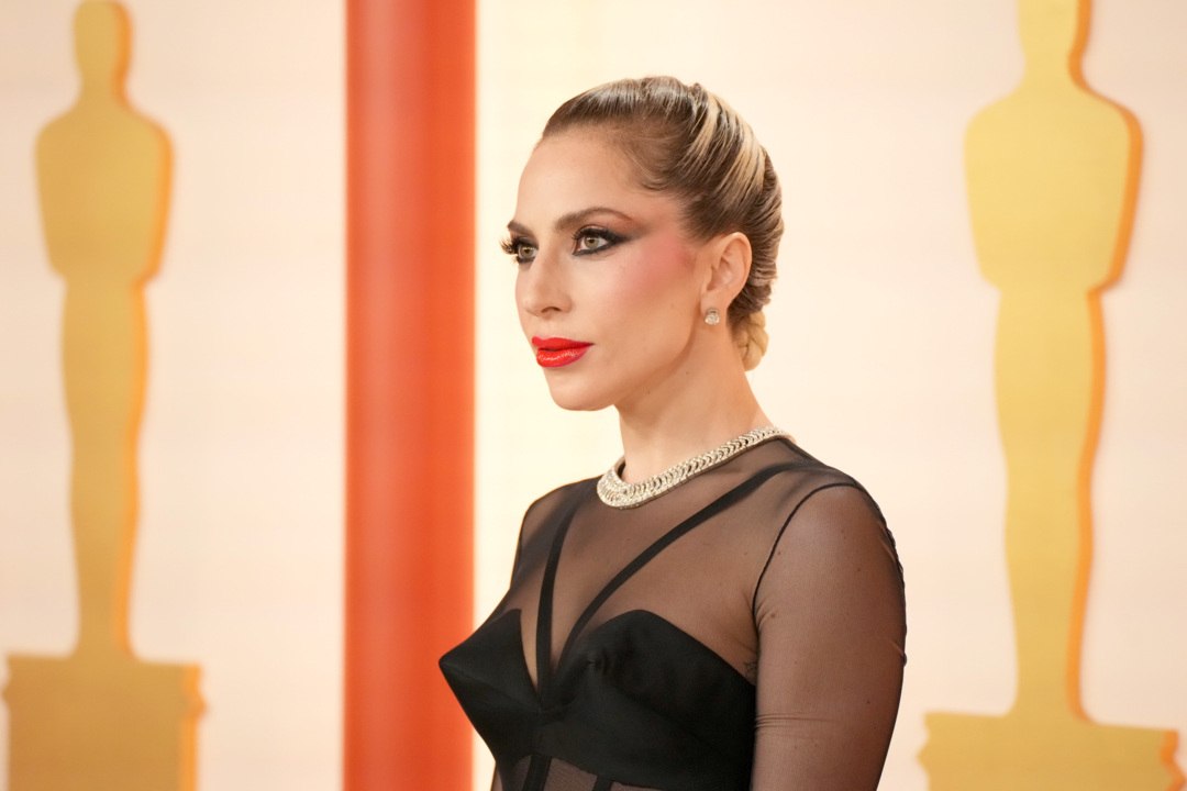 Lady Gaga Stunned at the 2023 Oscars Red Carpet in a Sheer Versace Gown
